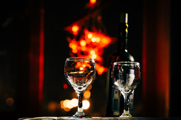 two wine glasses and defocused lights at the restaurant