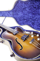 Obraz premium Vintage semi-acoustic bass guitar in original tweed case