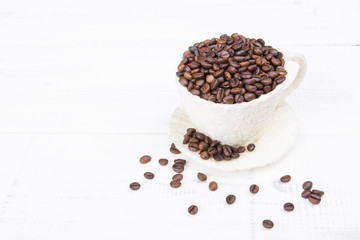 coffee beans cup on white wooden background