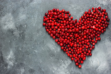 Heart of berries , red heart of cranberry , love and health concept