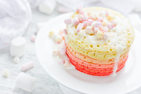 Romantic breakfast on Valentine Day - colorful pancake with marshmallow