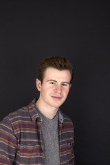 portrait  of positive looking young man