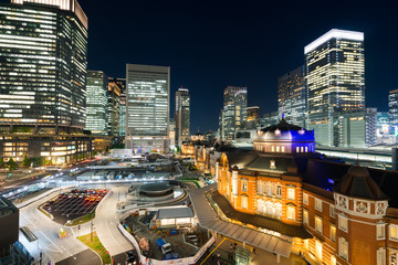Fototapeta na wymiar Business concept for real estate and corporate construction - panoramic modern city skyline bird eye aerial night view with tokyo station under dramatic glow and beautiful dark blue sky in Tokyo,Japan