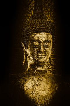 closeup ancient golden Thai Buddha in the temple