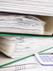 Stack of file folders with documents