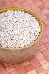barley groats in a brown bowl
