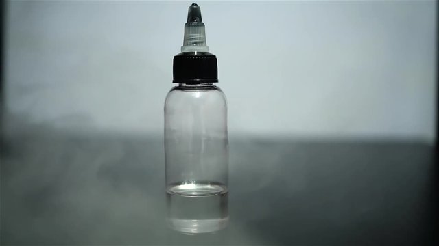 Jar with fluid for personal vaporisers and a lot of steam. Electronic nicotine delivery systems. ENDS.