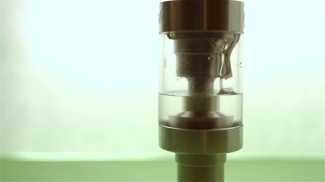 Filling of a tank for an electronic cigarette liquid close up. Rebuildable dripping atomizer (RDA). Electronic nicotine delivery systems. ENDS.