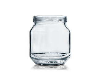 little empty glass jar without a lid isolated on a white background