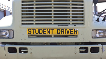 Student driver sign attached to front of semi truck. Horizontal.