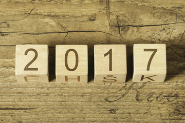 2017 written on cubes on wooden background