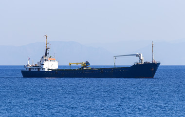 empty cargo ship sailing on the sea.Greece, Rhodes