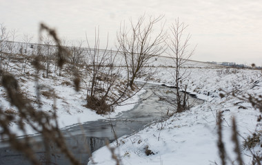 Winter field and river
