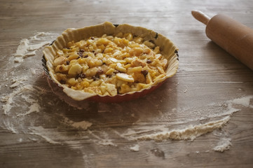 preparation of a homemade apple pie, step-by-step, window light