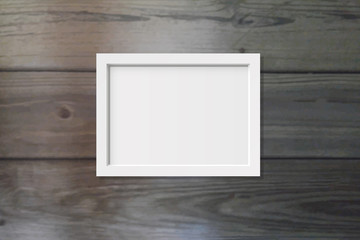 Picture frame on a wood background