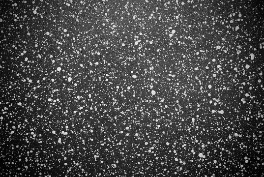 Abstract background of white point on a dark background. Non-stick coating pan