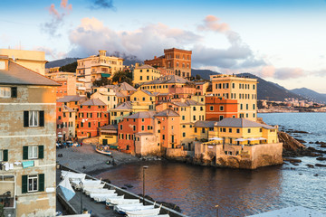 Fototapeta na wymiar Italy Liguria Genoa Panoramic view of Bocadasse district at sunset, a set of old colorful houses overlooking the sea and what was once a fishing village