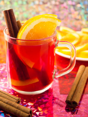 Mug of tea with citrus, cinnamon and orange