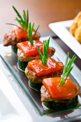 set of finger food - zucchini, grilled pork, red pepper and rosemary