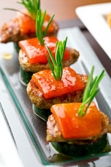 set of finger food - zucchini, grilled pork, red pepper and rosemary