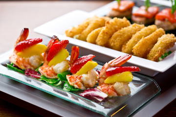 set of finger food - shrimps with mango and strawberry