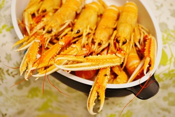 Platter of cooked orange langostinos from Brittany