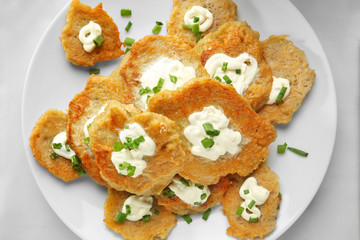 Plate with tasty potato pancakes for Hanukkah on table, closeup