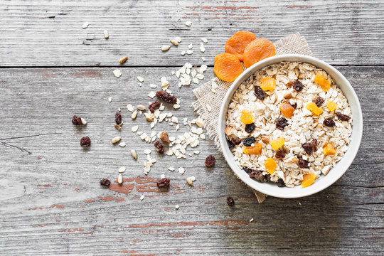 bowl of homemade muesli with nuts, dried fruits and sunflower seeds