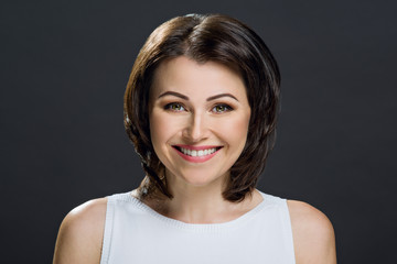 Portrait of a beautiful woman on a dark background