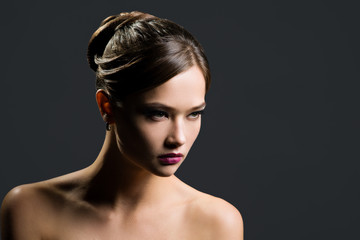 Fototapeta premium Portrait of a beautiful woman on a gray background