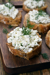 Sandwich with wholegrain bread, curd cheese and dill