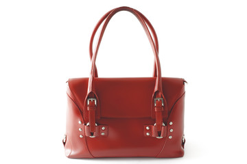 Red glossy female leather bag isolated on white background