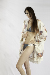 Thoughtful woman in swim suit