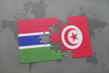 puzzle with the national flag of gambia and tunisia on a world map