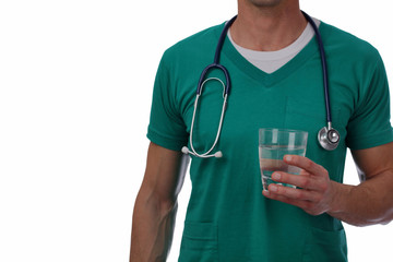 Male doctor holding glass of water close up isolated on white.