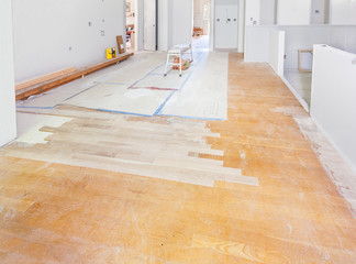 Patching hardwood floor - inserting new wood into floor areas exposed by the remodel