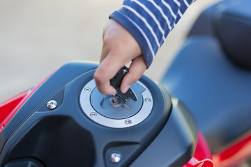 Hand the key open tank cap motorcycle fuel tank.