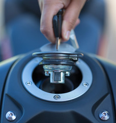 Hand the key open tank cap motorcycle fuel tank.