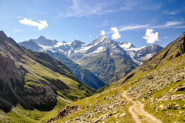 Stunning view of a hiking trail near Täschhütte in the Swiss Wallis Alps. In the background you...