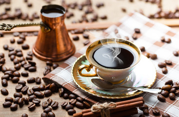 Black coffee in a cup on old background