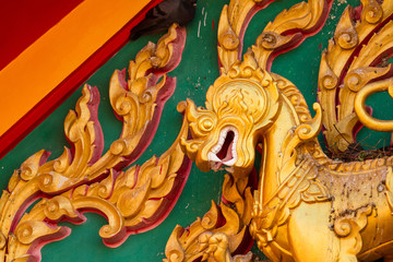 Fototapeta na wymiar Singh sclupture statue in Buddhist Thailand temple.