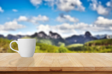 Cup of coffee on a wooden table.