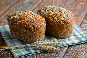 Bread and wheat on the old background