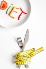 concept slimming diet fresh vegetables on white background top view