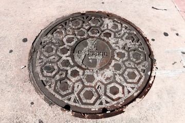 Street manhole cover US crossing