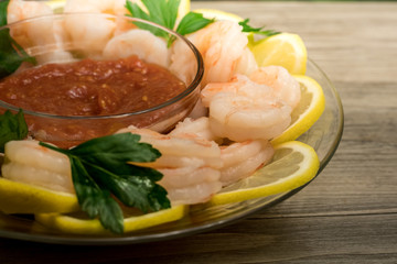 Shrimp cocktail andl sauce appetizer  with parsley sprigs