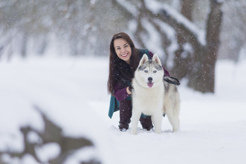 Happy Couple of Caucasian Brunette Woman Happy Smiling and Her Husky Dog