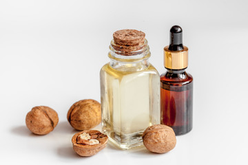 cosmetic and therapeutic walnut oil on white background