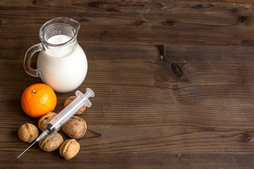 concept food allergies on wooden background