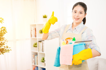 woman holding detergents thumbs up